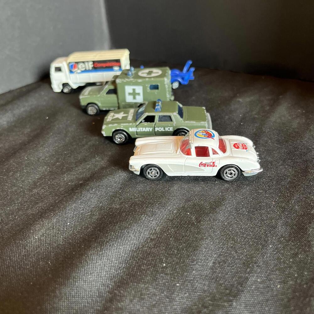 Vtg. Majorette Lot Of 4, ELF Truck, AMBULANCE, MILITARY POLICE & Coke Corvette